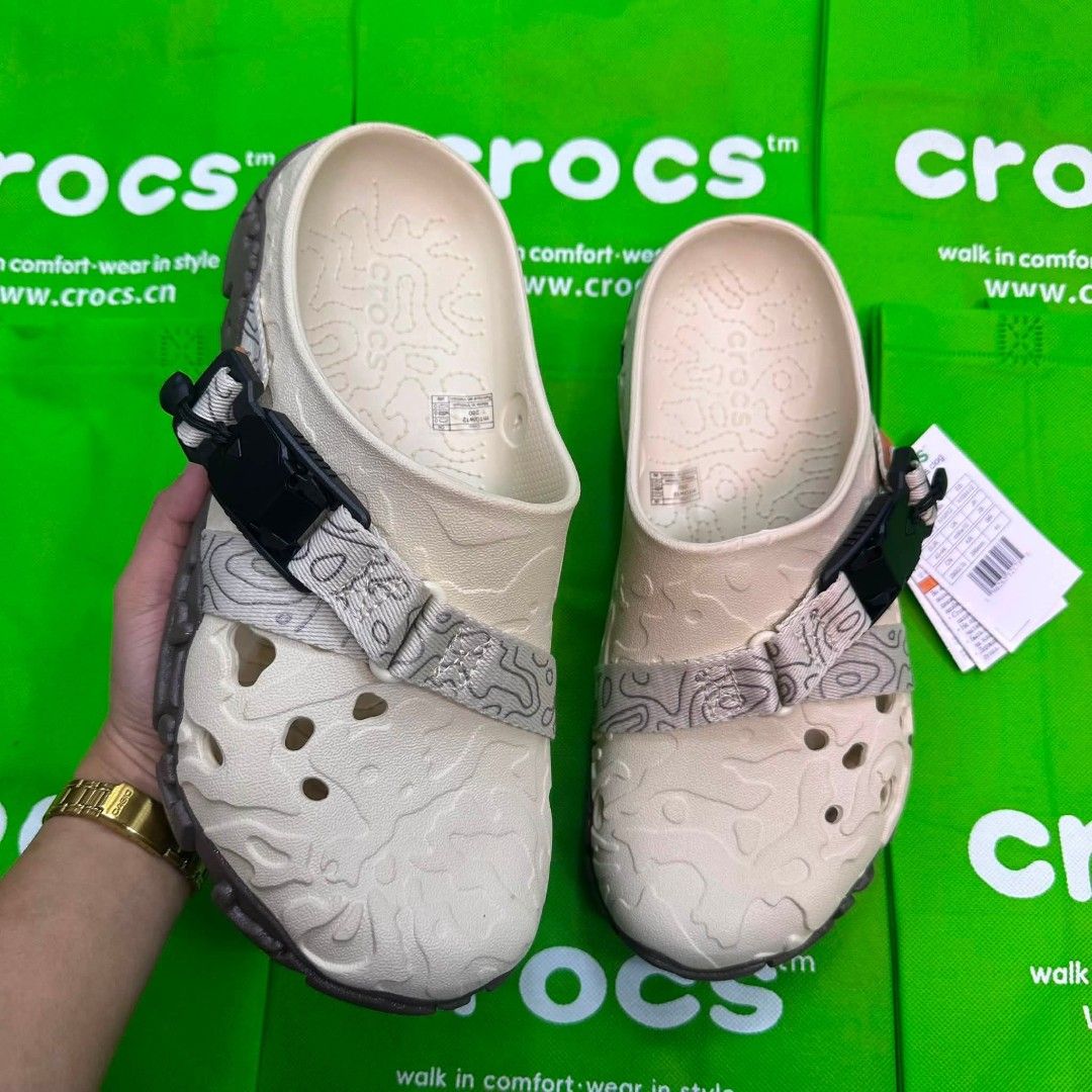 Crocs All-Terrain Clogs - Various Colors (Category: Slippers & Slides) located in Manila. Submitted by ddg_s (Listing ID 1459595025, Image 2). Description: Selling these Crocs All-Terrain Clogs. They have a rugged design with adjustable straps. Available in light grey, beige, black, white with neon green, and olive green. Great for outdoor adventures or casual wear. Comfortable and durable..