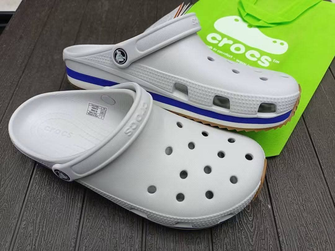Crocs Classic Clogs - Various Colors Available (Category: Slippers & Slides) located in Manila. Submitted by ddg_s (Listing ID 1459595199, Image 2). Description: - Comfortable and versatile Crocs clogs - Easy slip-on and off design - Ideal for everyday wear, gardening, or lounging - Made with durable and waterproof material - Available colors: black, grey, white, and beige.