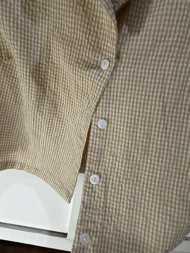 Crop Top and Shorts Set (Category: Sets or Coordinates) located in Malabon City. Submitted by julia4a_ (Listing ID 1459601836, Image 3). Description: - Adorable matching set in beige and white gingham. - Cropped short-sleeve top with button-up front. - High-waisted shorts with zipper and button closure. - Comfortable fabric, perfect for casual outings. - Can be worn together as a set or separately..