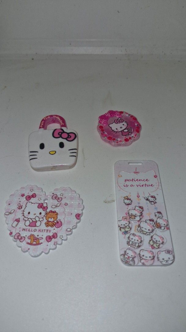 Charms bag , Heart, Round Charm, Rectangle Charm (Category: Charms) located in Quezon City. Submitted by belikabim2014 (Listing ID 1459677160, Image 1). Description: - Adorable pink and white Kitty accessory set. - Includes a cute bag-shaped charm. - Features a sweet heart-shaped charm. - Comes with a round charm showcasing Kitty. - Includes a rectangular charm with multiple Kitty designs and 'patience is a virtue' text. - Ideal for Kitty collect