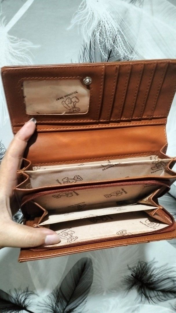 Cute Teddy Bear Floral Wallet (Category: Wallets & Card holders) located in Quezon City. Submitted by borresashl49573 (Listing ID 1459674405, Image 2). Description: - Tan wallet with charming floral and letter print.😍 - Adorable teddy bear charm on the front. ♥️ - Multiple card slots and compartments inside for organization. - Secure zipper closure..