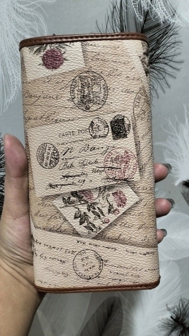 Cute Teddy Bear Floral Wallet (Category: Wallets & Card holders) located in Quezon City. Submitted by borresashl49573 (Listing ID 1459674405, Image 3). Description: - Tan wallet with charming floral and letter print.😍 - Adorable teddy bear charm on the front. ♥️ - Multiple card slots and compartments inside for organization. - Secure zipper closure..