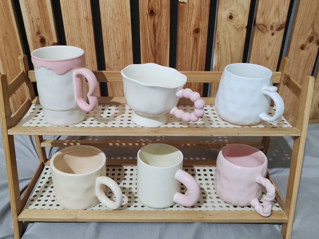 Cute/Kawaii Ceramic Mugs with Unique Handles (Category: Coffee & Tea Tableware) located in Quezon City. Submitted by lordeux.closet (Listing ID 1459567018, Image 2). Description: - Each mug features a distinct design - Fun, textured handles for a comfortable grip - Adorable animal and fruit designs available - Ideal for your daily coffee or tea - Makes a great gift for any occasion - Adds a playful and charming touch to your kitchenware.