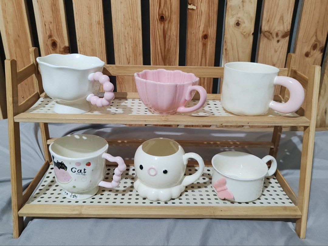 Cute/Kawaii Ceramic Mugs with Unique Handles (Category: Coffee & Tea Tableware) located in Quezon City. Submitted by lordeux.closet (Listing ID 1459567381, Image 1). Description: - Adorable ceramic mugs with unique, fun-shaped handles. - Features cute animal and fruit motifs. - Ideal for your morning coffee or tea. - Makes a perfect gift or a playful addition to your kitchenware..