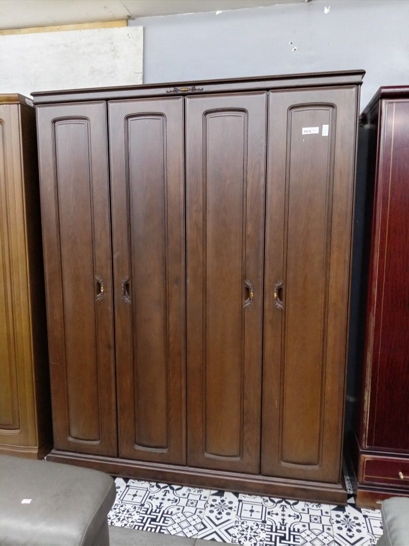 Dark Wood 4-Door Wardrobe (Category: Shelves, Cabinets & Racks) located in Manila. Submitted by keenhorse.30d35c (Listing ID 1459585327, Image 1). Description: - Spacious 4-door wardrobe - Rich dark wood finish - Classic door detailing - Ornate handles - Ample storage for clothes and personal items - Fits most bedroom styles - Ready for a new home.