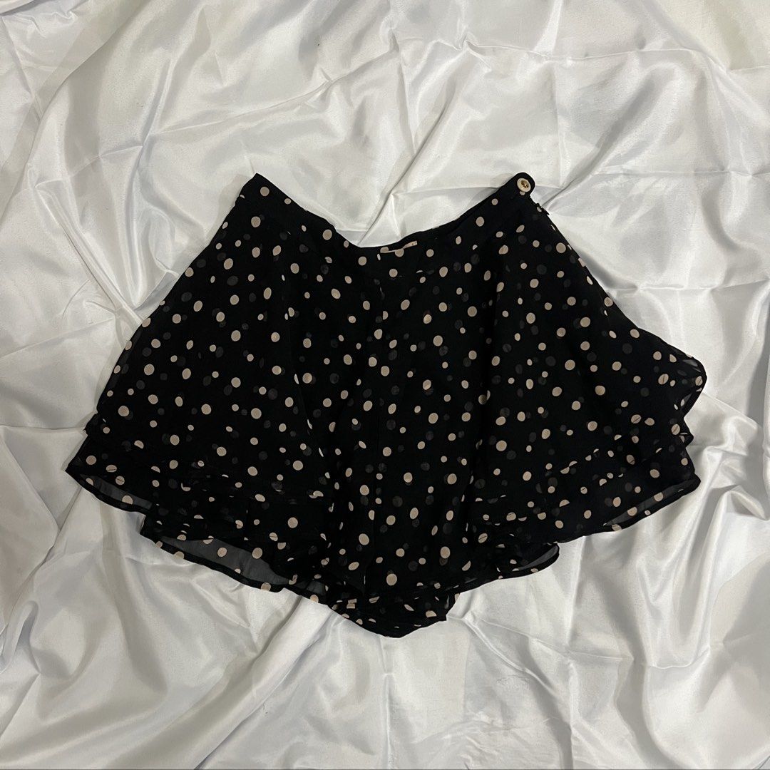 Dazzlin Black Polka Dot Ruffle Shorts (Category: Shorts) located in Imus. Submitted by niftees.eco (Listing ID 1459683774, Image 1). Description: Cute Dazzlin shorts with beige polka dots and a ruffled hem. Features two buttoned front pockets. Perfect for casual outfits. XS-S Size 26.