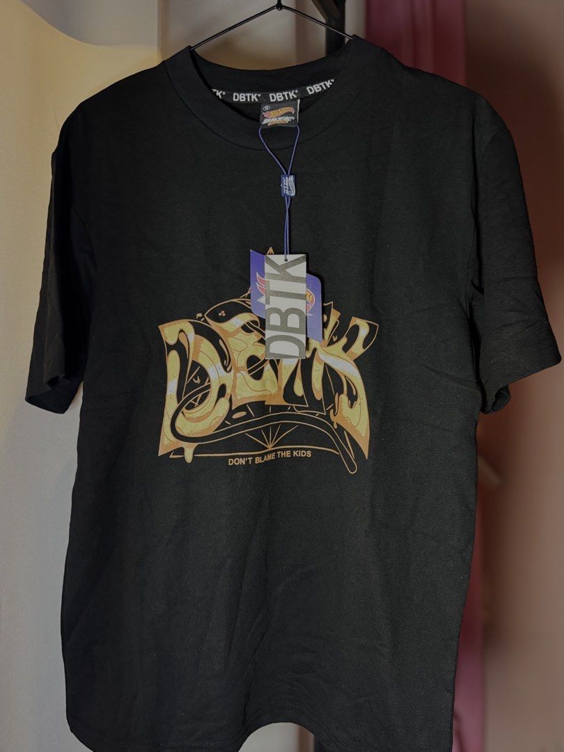 DBTK x Hot Wheels T-shirt OVERRUNS (Category: Tshirts & Polo Shirts ) located in Dasmarinas. Submitted by nicnicnicsu (Listing ID 1459521089, Image 2). Description: - Black DBTK T-shirt with cool graphic print - White DBTK x Hot Wheels collaboration T-shirt -Premium quality - sizes M-XL - Features vibrant and detailed graphics - Ideal for collectors and streetwear enthusiasts - Unique pieces, grab them now!.