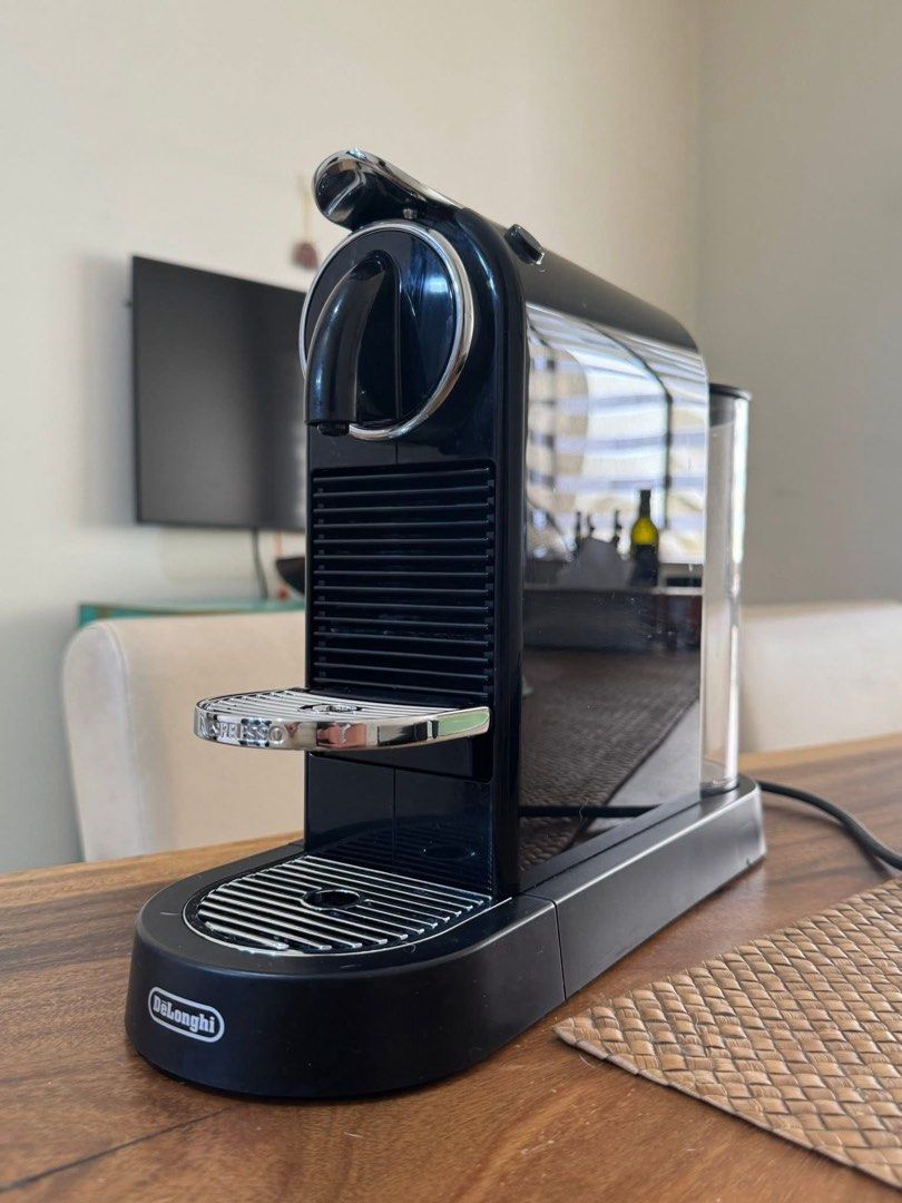 DeLonghi Nespresso Citiz with pod drawer (Category: Coffee Machines & Makers) located in Quezon City. Submitted by jeloiu09 (Listing ID 1459674309, Image 1). Description: - Black DeLonghi Nespresso Citiz coffee machine - Convenient slide-out drawer for coffee pods - Simple to use for your daily coffee needs - Detachable water tank for easy refilling - Compact design, ideal for small kitchens.