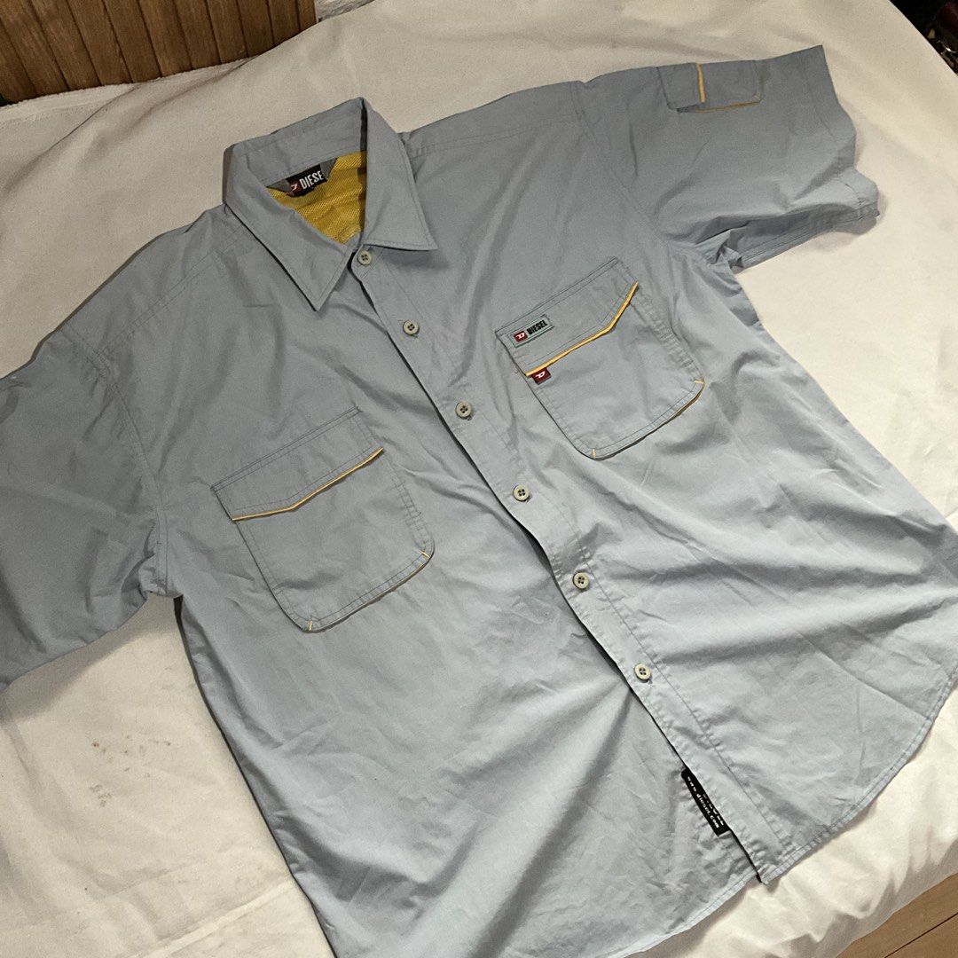 Diesel Short Sleeve Button Up Shirt (Category: Tshirts & Polo Shirts ) located in Quezon City. Submitted by aliyah06 (Listing ID 1459511830, Image 1). Description: I bought this for myself, but my grandfather used this on my debut NO ISSUE GOOD AS NEW ! PAYMENT FIRST POLICY ! NO REFUND OR CANCEL ONCE RESERVED ! ALL ITEMS ARE WASH AND READY TO WEAR MOP: GCASH MOD: GRAB OR LALAMOVE LOCATION: Welcome Rotonda, QC - Light blue Diesel short sleeve shir