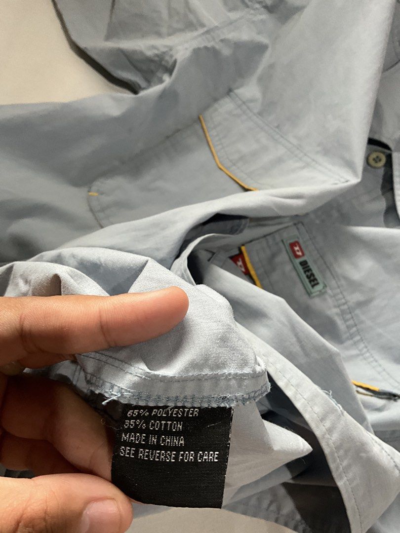 Diesel Short Sleeve Button Up Shirt (Category: Tshirts & Polo Shirts ) located in Quezon City. Submitted by aliyah06 (Listing ID 1459511830, Image 3). Description: I bought this for myself, but my grandfather used this on my debut NO ISSUE GOOD AS NEW ! PAYMENT FIRST POLICY ! NO REFUND OR CANCEL ONCE RESERVED ! ALL ITEMS ARE WASH AND READY TO WEAR MOP: GCASH MOD: GRAB OR LALAMOVE LOCATION: Welcome Rotonda, QC - Light blue Diesel short sleeve shir