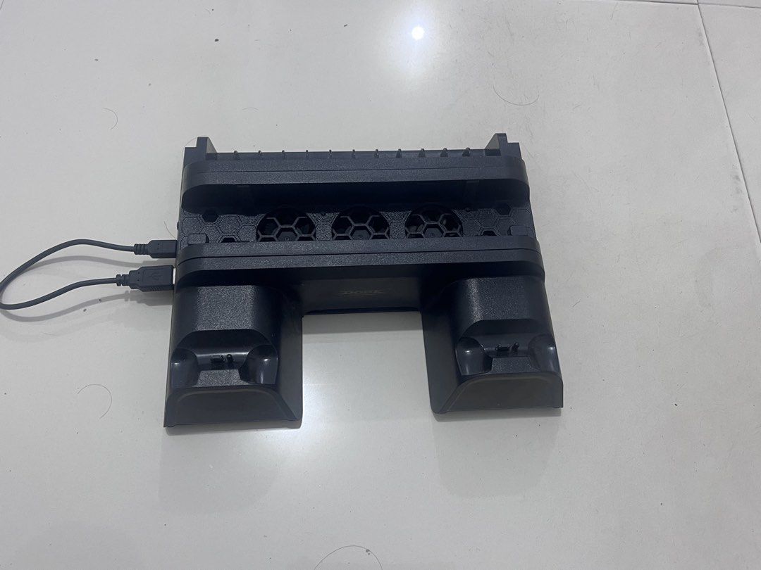 DOBE PS4 Slim Pro Multifunctional Cooling Charging Dock (Category: PlayStation) located in Castillejos. Submitted by anthony88888 (Listing ID 1459577197, Image 2). Description: - Charges up to 2 PS4 Slim/Pro controllers simultaneously. - Built-in cooling fans to prevent overheating. - Connects easily via USB. - Keeps your controllers charged and ready for action..