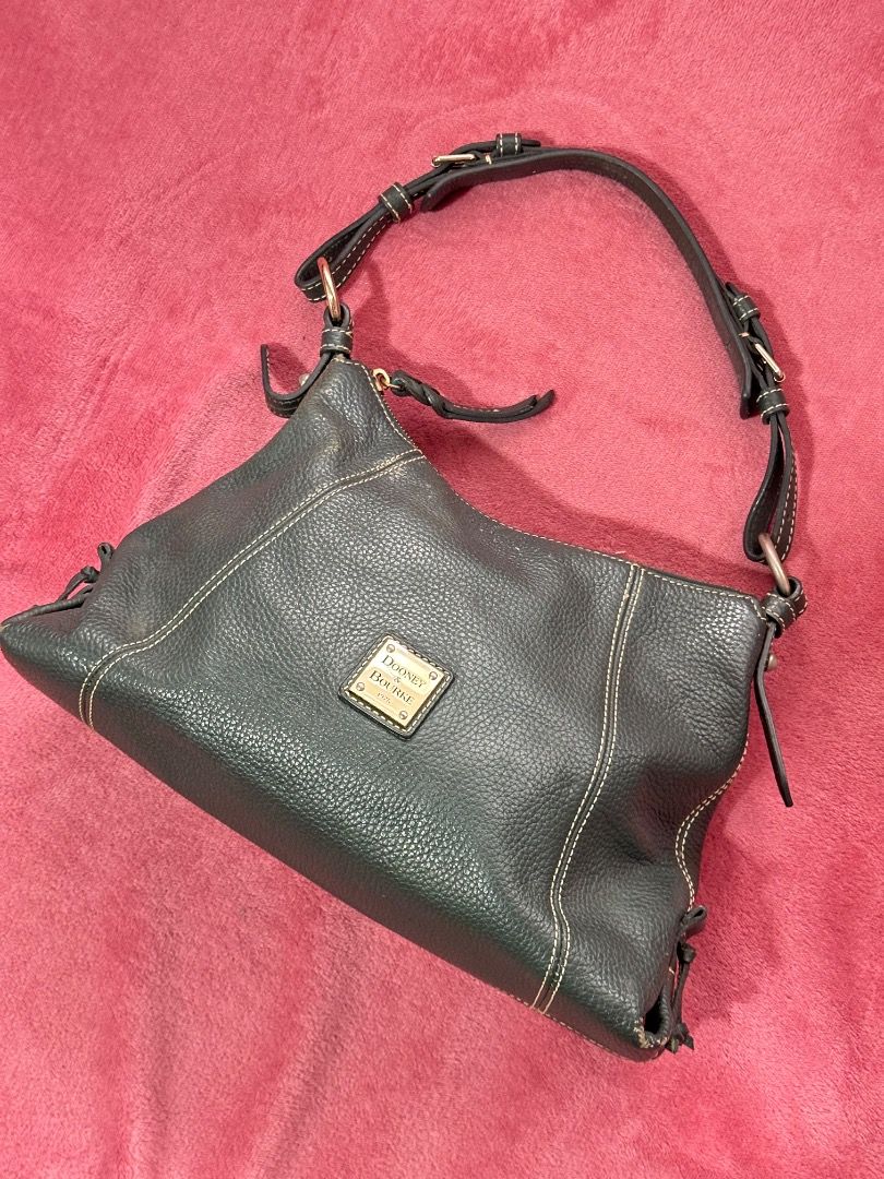 Dooney & Bourke Pebble Grain Leather Shoulder Bag (Category: Luxury Bags & Wallets) located in Caloocan City. Submitted by gandara12345678 (Listing ID 1459601375, Image 1). Description: - Classic Dooney & Bourke shoulder bag - Made from dark green pebble grain leather - Interior with multiple pockets for organization - Secure zipper closure - Timeless and perfect for carrying everyday essentials.
