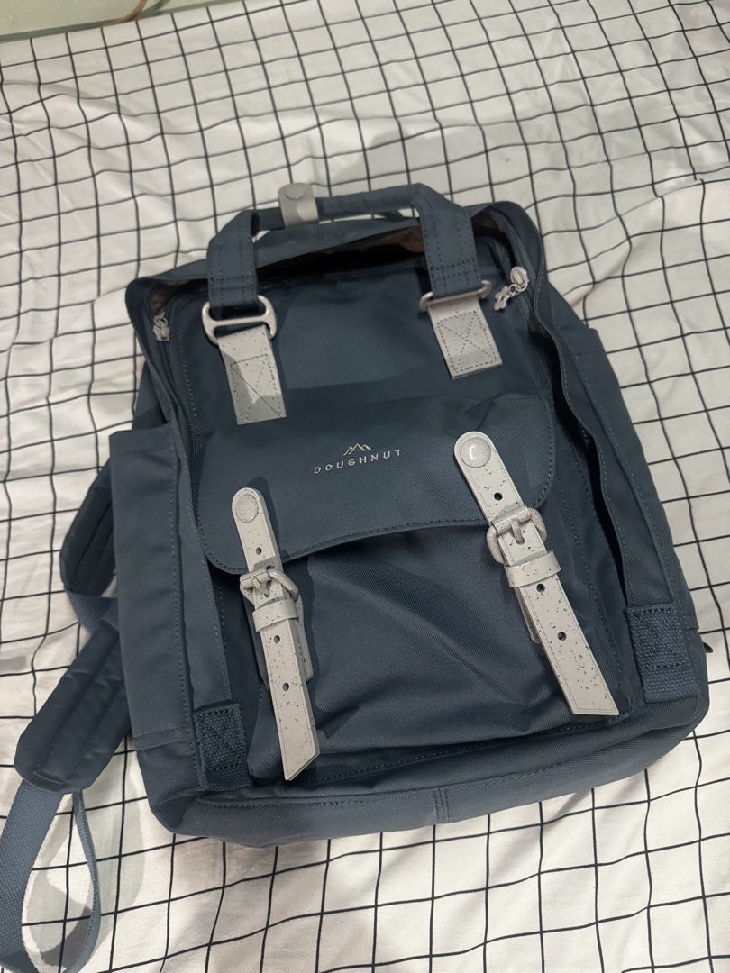 Doughnut Macaroon Backpack (Category: Backpacks) located in Mandaluyong City. Submitted by maejoselle (Listing ID 1459571275, Image 2). Description: - Stylish blue-grey Doughnut Macaroon backpack - Features a charming floral lining inside - Multiple pockets for excellent organization - Adjustable straps for a comfortable fit Rubber yung straps - Ideal for daily use or short getaways Used for a week lang. Kakabili lang last month. I realized di ko