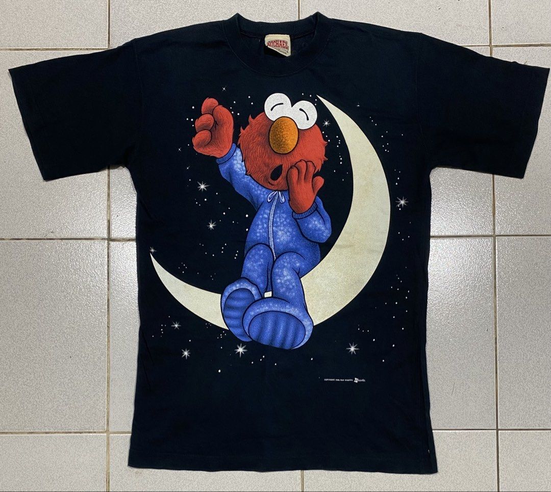 Elmo Tshirt Michael Tag (Category: Tshirts & Polo Shirts ) located in Mandaue City. Submitted by MJ_80 (Listing ID 1459631895, Image 1). Description: 1998 Elmo Vintage Tshirt Glow in the dark print on halfmonm Medium Dimes: 18.5 X 27.5 See photos for measurements Color rate & Condition: 9.9/10 Price: 1,350 .