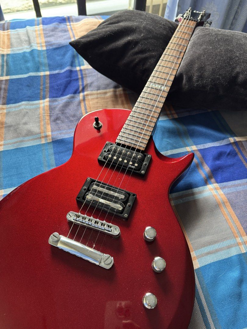 ESP LTD EC-50 Electric Guitar — Candy Apple Red (Category: Musical Instruments) located in Las Pinas. Submitted by riabautista (Listing ID 1459546421, Image 2). Description: ESP LTD EC-50 Electric Guitar — Candy Apple Red Single-cutaway Les Paul-style body in a gorgeous deep red finish that just pops under stage lights — this thing photographs way better than it has any right to for its price point. 😄 Solid basswood body, maple neck, rosewood fr