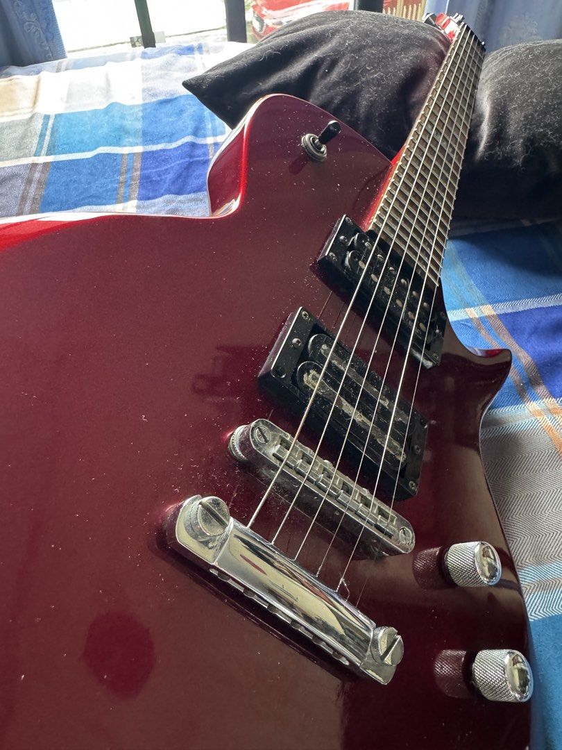 ESP LTD EC-50 Electric Guitar — Candy Apple Red (Category: Musical Instruments) located in Las Pinas. Submitted by riabautista (Listing ID 1459546421, Image 3). Description: ESP LTD EC-50 Electric Guitar — Candy Apple Red Single-cutaway Les Paul-style body in a gorgeous deep red finish that just pops under stage lights — this thing photographs way better than it has any right to for its price point. 😄 Solid basswood body, maple neck, rosewood fr
