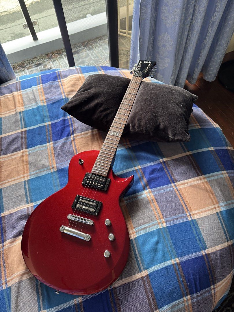 ESP LTD EC-50 Electric Guitar — Candy Apple Red (Category: Musical Instruments) located in Las Pinas. Submitted by riabautista (Listing ID 1459546421, Image 1). Description: ESP LTD EC-50 Electric Guitar — Candy Apple Red Single-cutaway Les Paul-style body in a gorgeous deep red finish that just pops under stage lights — this thing photographs way better than it has any right to for its price point. 😄 Solid basswood body, maple neck, rosewood fr