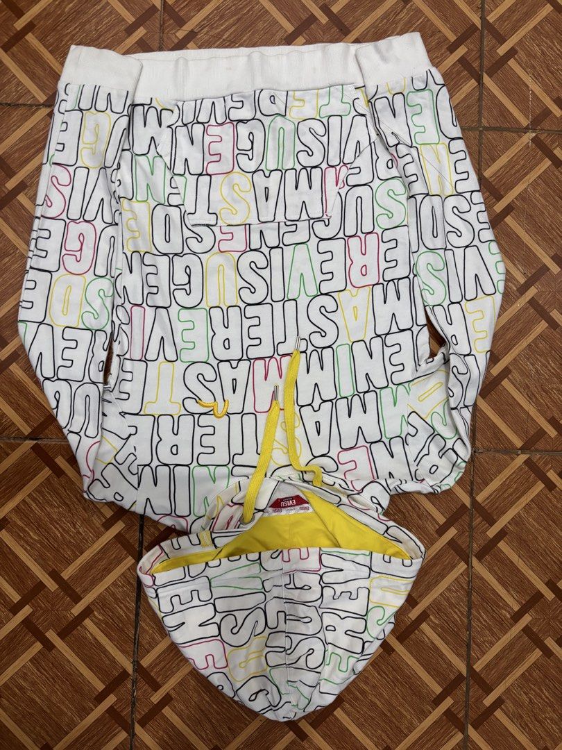 EVISU All Over Print Hoodie (Category: Hoodies) located in Manila. Submitted by ch1lleroli82692 (Listing ID 1459607011, Image 1). Description: - White hoodie with vibrant, all-over Evisu logo print. - Convenient front pocket for essentials. - Stylish yellow drawstrings for adjustable comfort. - Ideal for a cool, casual everyday look..