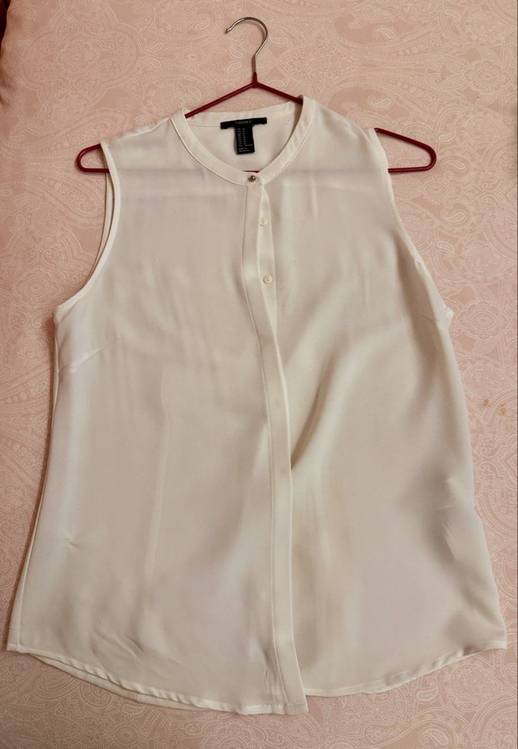F21 White Blouse (Sleeveless) (Category: Blouses) located in Manila. Submitted by vet.md (Listing ID 1459666123, Image 1). Description: Used twice.