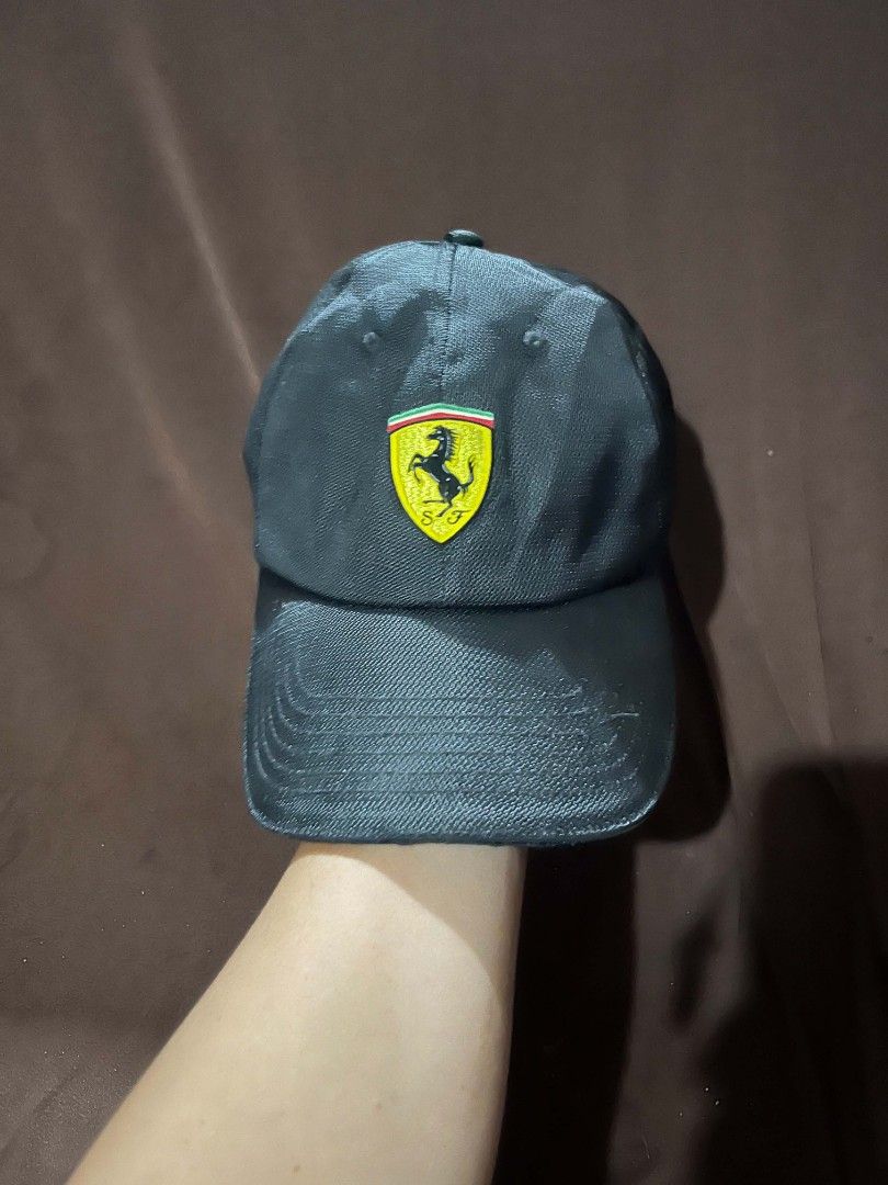 Ferrari Store Roma Black Baseball Cap (Category: Caps & Hats) located in Baroy. Submitted by laudecarlfe24 (Listing ID 1459620343, Image 1). Description: - Genuine Ferrari cap from the official Ferrari Store in Rome. - Iconic Ferrari Shield logo prominently displayed on the front. - 'Ferrari Store Roma' embroidered detail on the back. - Material: 100% Polyester for durability and comfort. - Sizing: One size fits most, ensuring a comfortable fit. 