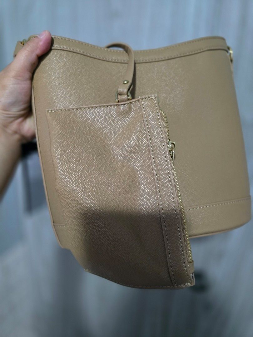 Figlia Beige Textured Leather Shoulder Bag with Pouch (Category: Shoulder Bags) located in Quezon City. Submitted by mariescloset2020 (Listing ID 1459524111, Image 3). Description: - Brand: Figlia - Color: Beige - Material: Textured Leather - Features: Matching zippered pouch, gold hardware, adjustable strap - Condition: Brand new with tag attached - Ideal for: Everyday use.