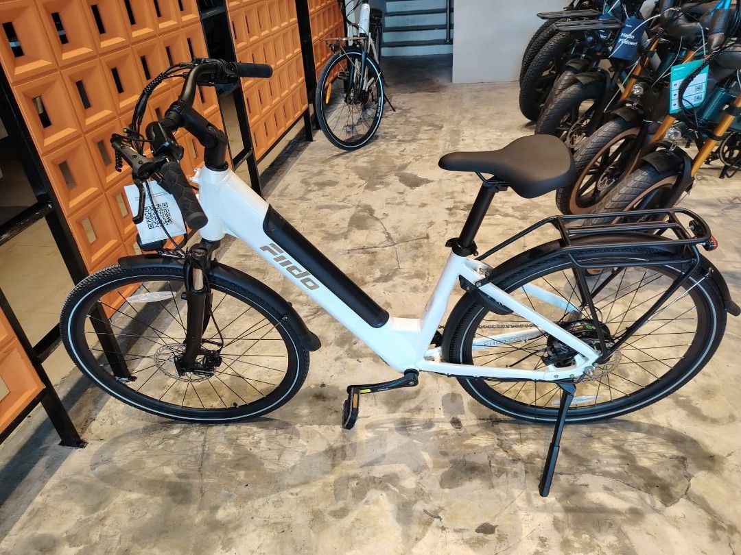 FIIDO Electric Bike White Step-Through Frame (Category: Bicycles) located in Manila. Submitted by jomspopcycle (Listing ID 1459514367, Image 1). Description: - White FIIDO electric bike - Easy step-through frame for convenient mounting - Includes rear rack and fenders - Reliable disc brakes on both wheels - Front suspension fork for a smoother ride - Ideal for daily commutes and leisurely rides around town.
