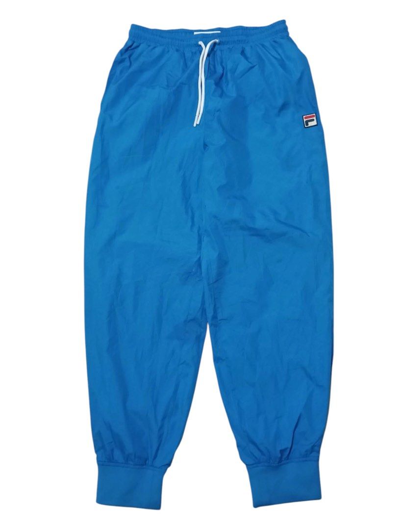 FILA Windbreaker Track Pants (Category: Activewear) located in Manila. Submitted by rarefindsgallery (Listing ID 1459592728, Image 1). Description: FILA Windbreaker Track Pants Size: Medium Fits medium to large Material: Nylon, Quick dry Good for mountaineering and other outdoor activities .