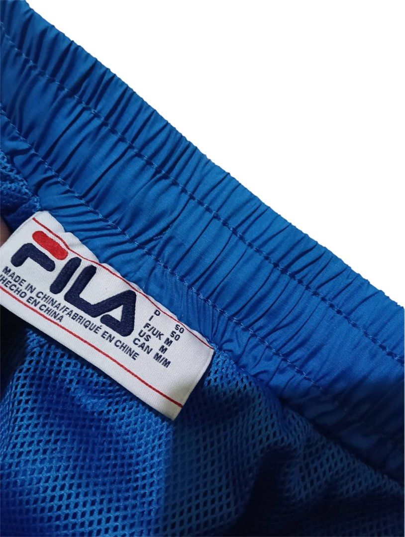 FILA Windbreaker Track Pants (Category: Activewear) located in Manila. Submitted by rarefindsgallery (Listing ID 1459592728, Image 3). Description: FILA Windbreaker Track Pants Size: Medium Fits medium to large Material: Nylon, Quick dry Good for mountaineering and other outdoor activities .