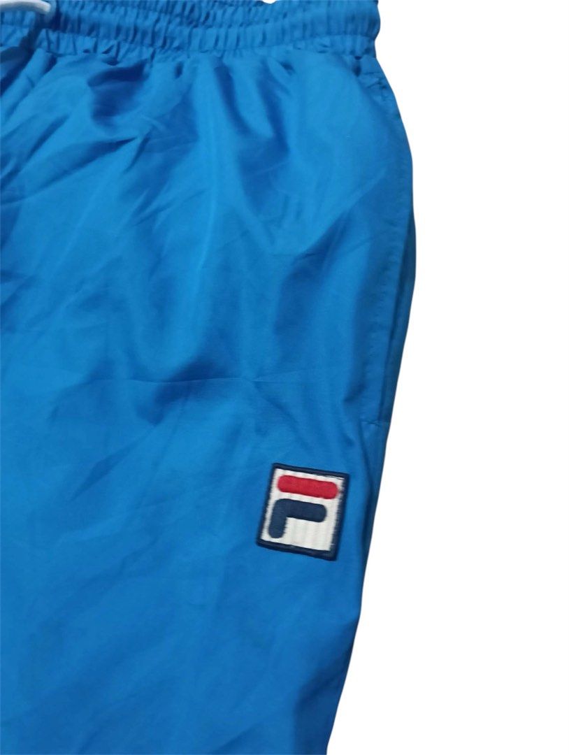 FILA Windbreaker Track Pants (Category: Activewear) located in Manila. Submitted by rarefindsgallery (Listing ID 1459592728, Image 2). Description: FILA Windbreaker Track Pants Size: Medium Fits medium to large Material: Nylon, Quick dry Good for mountaineering and other outdoor activities .