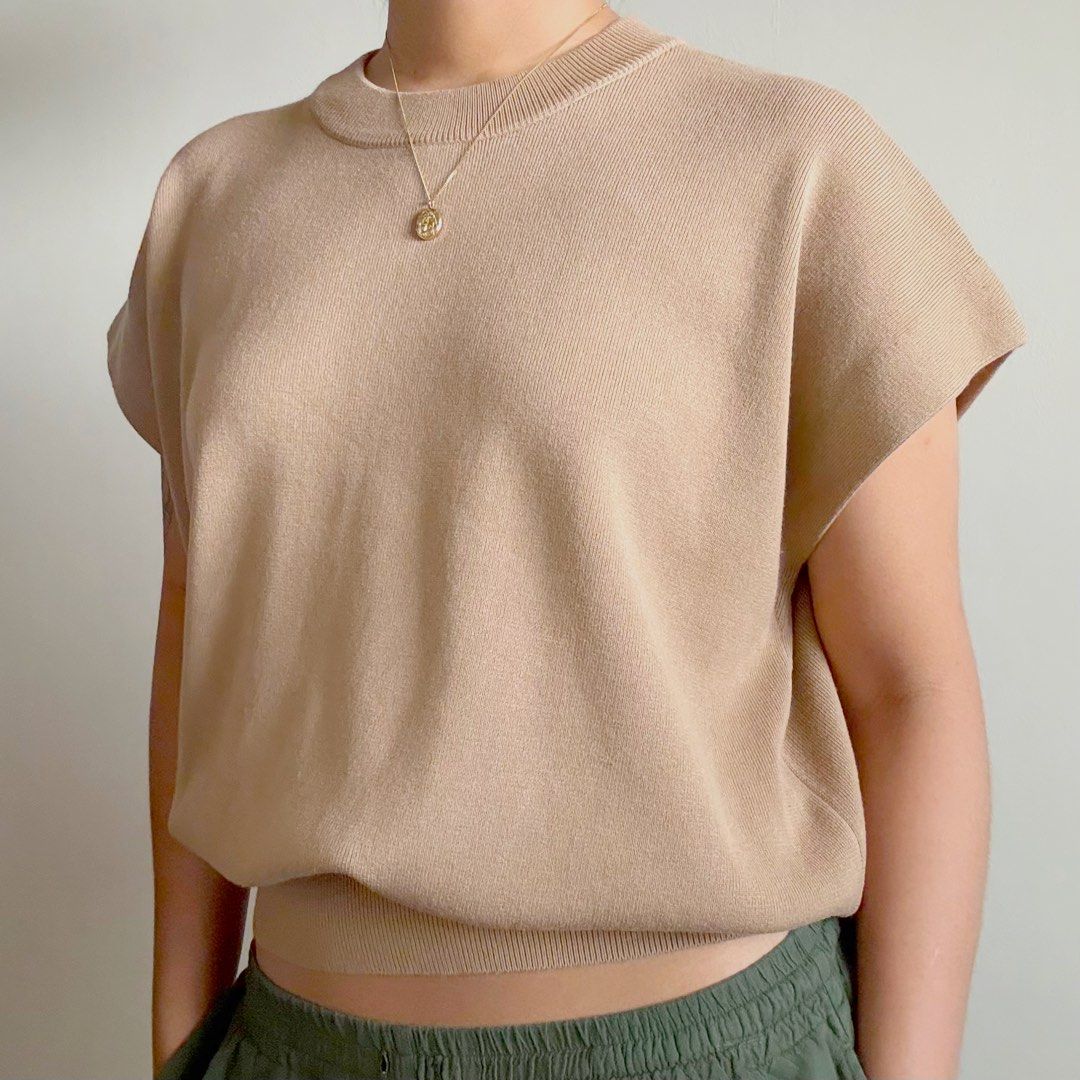 for me Cap-Sleeve Knit Top (Category: Others Tops) located in Muntinlupa City. Submitted by trishaswardrobe (Listing ID 1459624123, Image 1). Description: - For Me sleeveless sweater - Size: XXL (I'm L but I like oversized) - Color: Tan - Features: Round neckline, relaxed fit - Style: Versatile, can be dressed up or down.