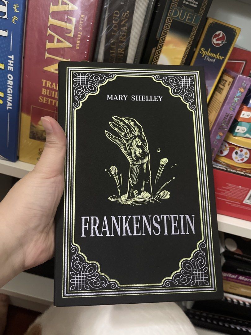 Frankenstein by Mary Shelley - Classic Novel (Category: Storybooks) located in Quezon City. Submitted by byebooks (Listing ID 1459524179, Image 1). Description: - Classic Frankenstein novel by Mary Shelley - Features a striking black cover - Includes a unique hand illustration - Ideal for literature fans and collectors - A must-have for gothic literature enthusiasts NOTE: ONLY ENTERTAINING BUYERS WHO WILL USE GRAB OR LALAMOVE OR ANYTHING SIMILAR 