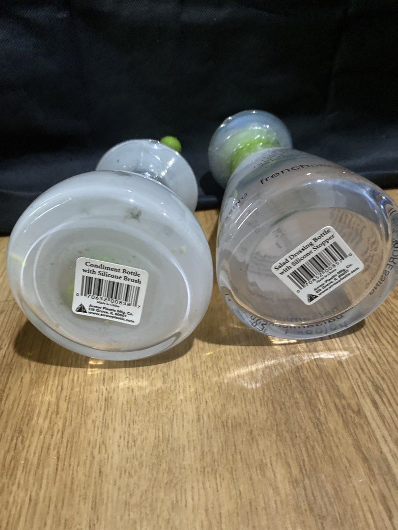 French Dressing Bottle and Condiment Bottle Set (Category: Breastfeeding & Bottle Feeding) located in Taguig. Submitted by cosmickindle (Listing ID 1459579778, Image 2). Description: - Set of two glass dressing bottles - One bottle features a printed French dressing recipe - Second bottle includes a built-in silicone brush for easy application - Both bottles come with secure silicone stoppers - Stylish green accents on both bottles - Ideal for cr