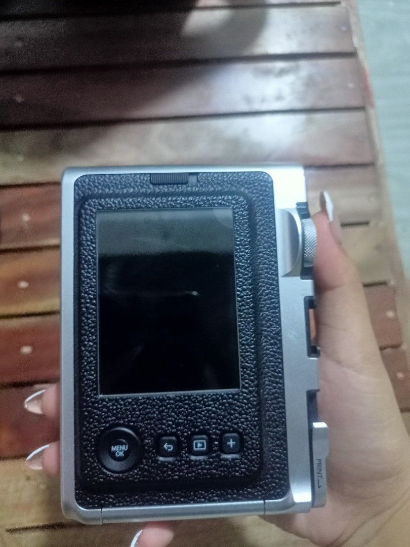 Fujifilm Instax Mini EVO Instant Camera with Case (Category: Cameras) located in Caloocan City. Submitted by lexongayet58763 (Listing ID 1459628895, Image 3). Description: - Fujifilm Instax Mini EVO: Digital instant camera - Comes with a stylish black leather case - Lens: Instax 28mm F2.0 - Focus range: 0.1m to infinity - Features a rear screen for easy viewing and settings - Capture and print your memories instantly! no box😞 willing to meetup o