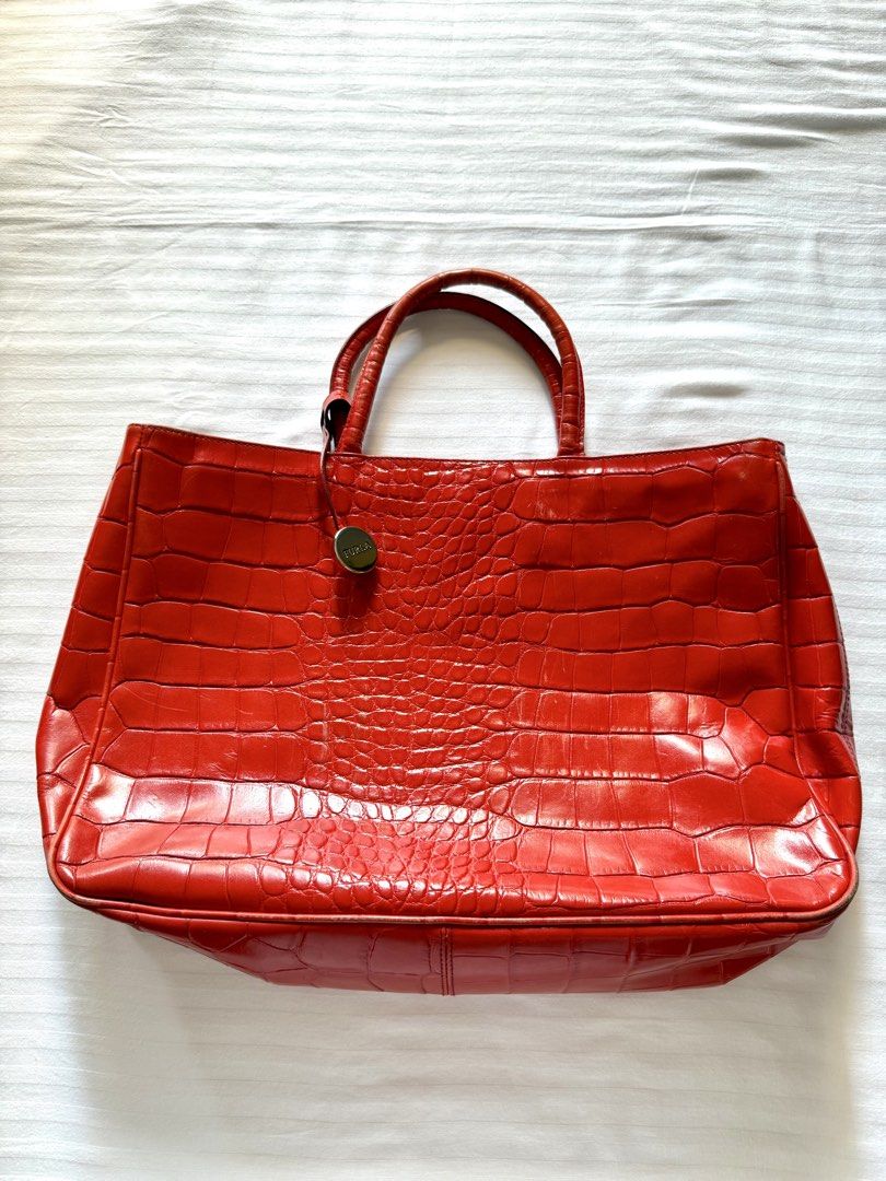 Furla Red Croc Embossed Leather Tote Bag (Category: Luxury Bags & Wallets) located in Quezon City. Submitted by janavdd (Listing ID 1459540446, Image 2). Description: Selling a Furla Red Croc Embossed Leather Tote Bag for Php 4999 only! - Retails for $250 and above (around Php 15.5k+) - Elegant croc embossed texture - Spacious interior with a secure zippered compartment - Comfortable top handles for easy carrying - Classic and versatile design by