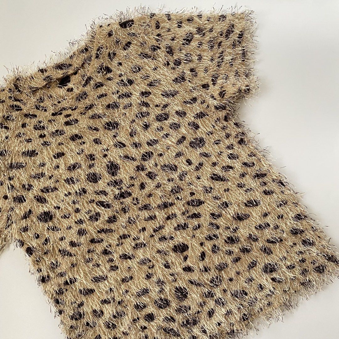 Fuzzy Leopard Print Short Sleeve T-Shirt (Category: Shirts) located in Iloilo. Submitted by luckyeagle_1c5618 (Listing ID 1459622636, Image 2). Description: - Super fuzzy t-shirt - Trendy leopard print (tan base with black spots) - Comfortable short sleeves - Unique, fun texture - Perfect for a bold statement outfit.