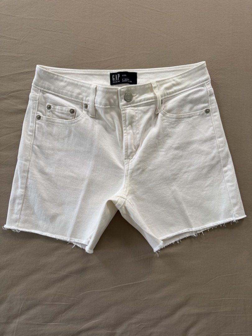 GAP Denim White Cut-Off Shorts Size 0/25 (Category: Shorts) located in Narvacan. Submitted by richandreinscloset (Listing ID 1459577160, Image 1). Description: ‼️Almost new. Worn few times only - Brand: GAP - Color: White - Style: Denim Shorts - Size: 0/25 - Features: Cut-off hem detail - Inseam: 5 inches - Perfect for: Casual wear, easy to pair with any top - Condition: Please check photos for details.