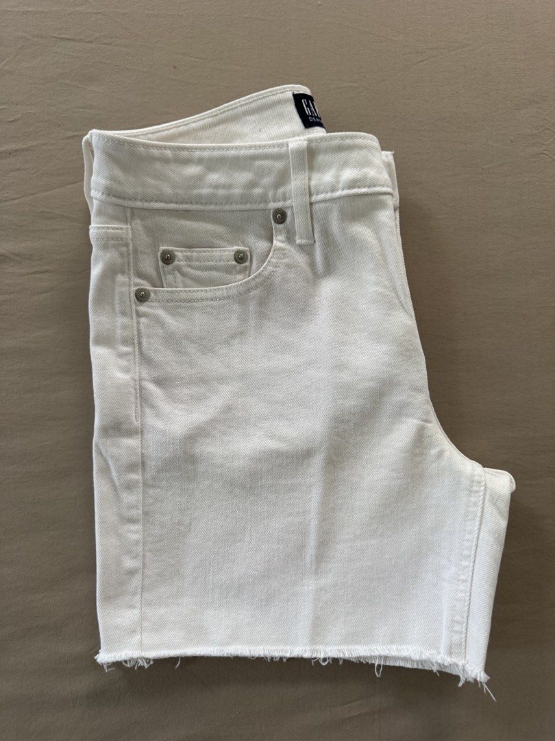 GAP Denim White Cut-Off Shorts Size 0/25 (Category: Shorts) located in Narvacan. Submitted by richandreinscloset (Listing ID 1459577160, Image 3). Description: ‼️Almost new. Worn few times only - Brand: GAP - Color: White - Style: Denim Shorts - Size: 0/25 - Features: Cut-off hem detail - Inseam: 5 inches - Perfect for: Casual wear, easy to pair with any top - Condition: Please check photos for details.