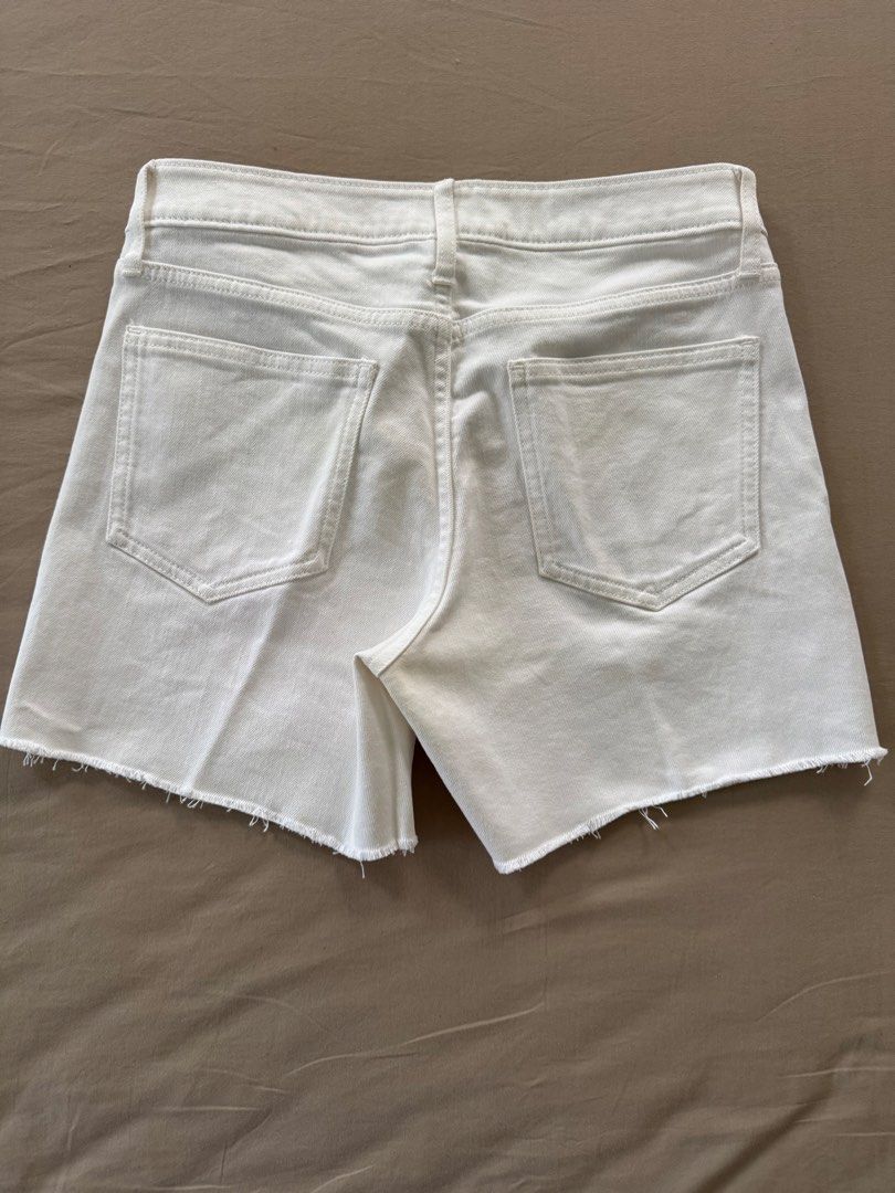 GAP Denim White Cut-Off Shorts Size 0/25 (Category: Shorts) located in Narvacan. Submitted by richandreinscloset (Listing ID 1459577160, Image 2). Description: ‼️Almost new. Worn few times only - Brand: GAP - Color: White - Style: Denim Shorts - Size: 0/25 - Features: Cut-off hem detail - Inseam: 5 inches - Perfect for: Casual wear, easy to pair with any top - Condition: Please check photos for details.