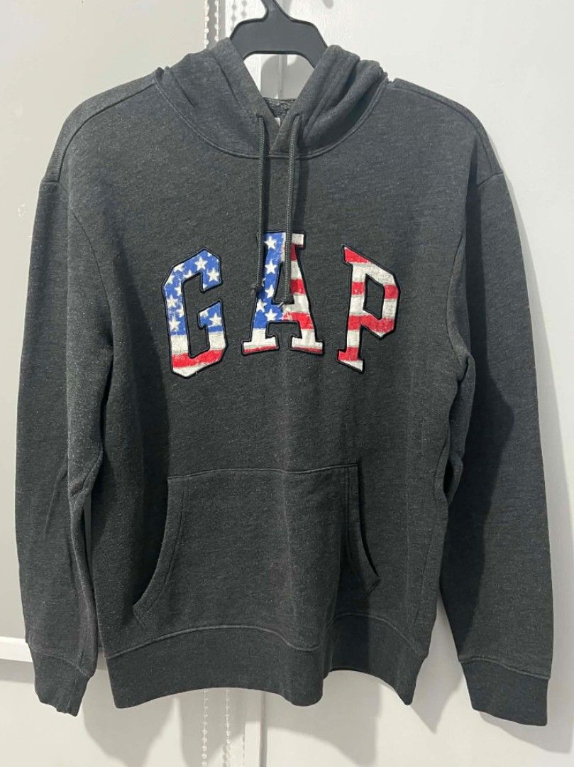 GAP Hoodie Grey American Flag Logo (Category: Coats, Jackets and Outerwear) located in Caloocan City. Submitted by kle.en (Listing ID 1459636737, Image 1). Description: Bought in Japan. A classic Gap Pullover hoodie in a heathered charcoal grey with iconic gap arch logo filled with american flag design. Best to match it with black or dark grey joggers for a relaxed, cozy vibe. 💨 .