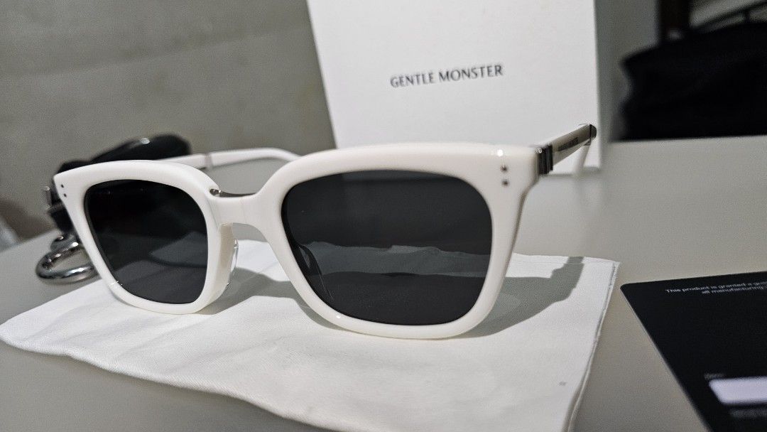 Gentle Monster White Sunglasses with Case and Box (Category: Sunglasses & Eyewear) located in Manila. Submitted by buyproperty (Listing ID 1459586205, Image 1). Description: - White Gentle Monster sunglasses - Comes with original box, black leather case, and cleaning cloth - Stylish and perfect for everyday wear - Ideal for sunny days out.