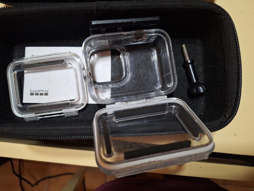 GoPro HERO9 Black Protective Housing Case (Category: Camera Bags & Carriers) located in Cebu City. Submitted by hotgirltings (Listing ID 1459657273, Image 2). Description: - Protective housing specifically for GoPro HERO9 Black - Set includes the main housing, a spare open back cover for easy screen navigation, and a mounting screw - All items come neatly organized in a zippered case - Purchased on July 6, 2021 - Selling as a set :).