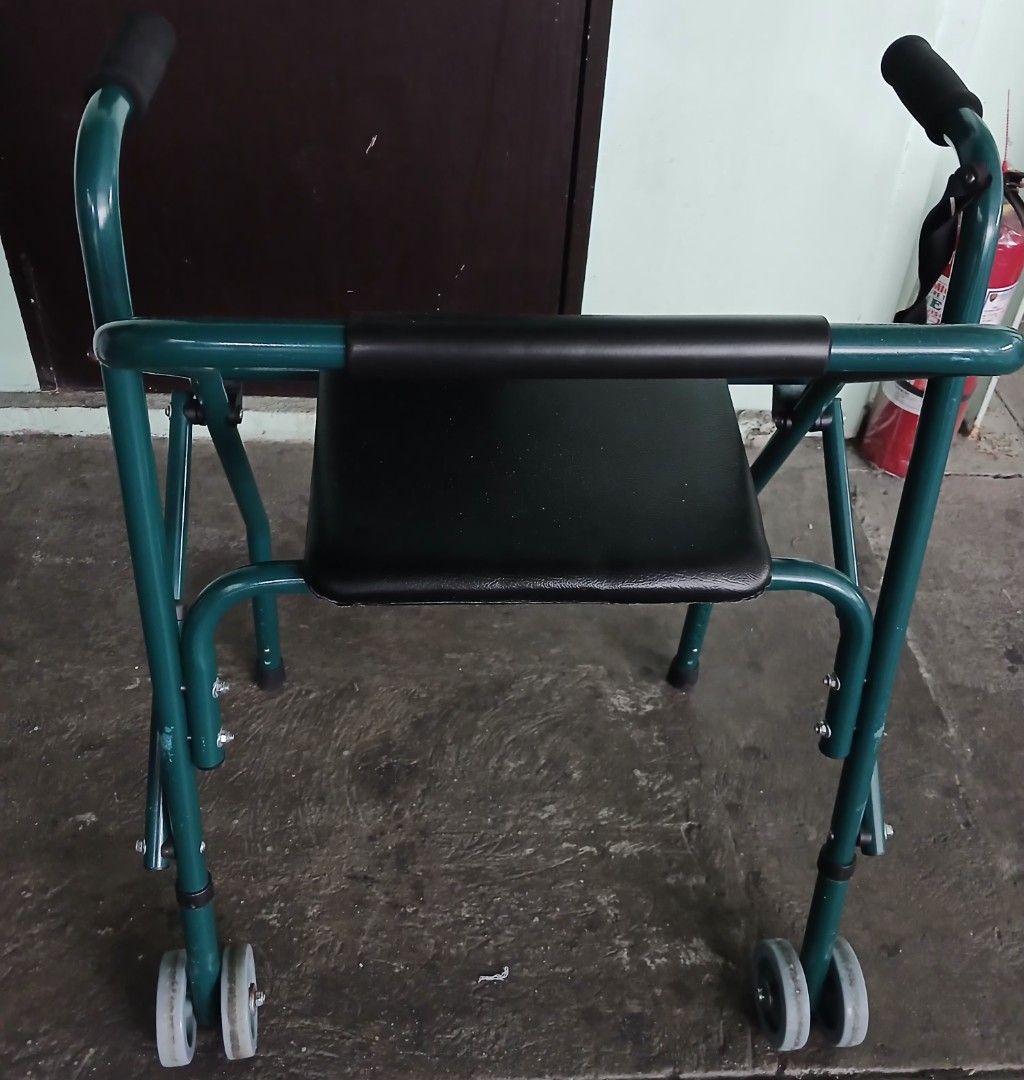 Green Walker with Seat & Wheels (Category: Rehabilitative Devices) located in Mandaluyong City. Submitted by gantan.tree (Listing ID 1459606024, Image 2). Description: - Green mobility walker - Built-in seat for resting - Front wheels for easy movement - Padded handles for comfort - Folds for convenient storage - Ideal for mobility assistance Freebie: 1 reflex hammer MOP: cash/bank transfer/Gcash (# under About).