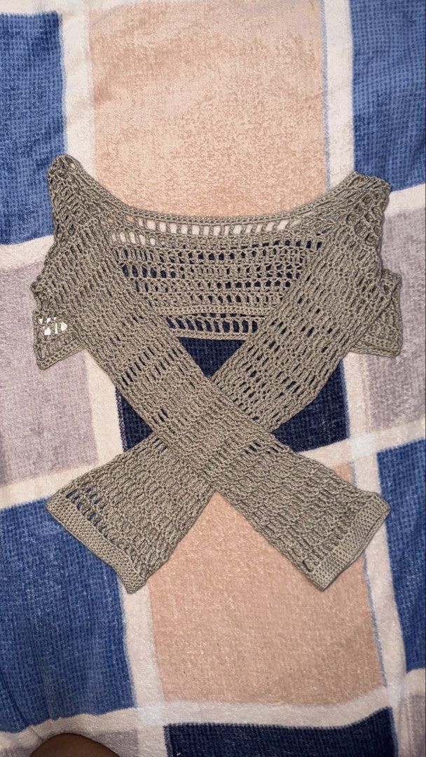 Grey Crochet Long Sleeve Crop Top (Category: Others Tops) located in Quezon City. Submitted by e182885da6246a5b75aac67add07a3 (Listing ID 1459534661, Image 1). Description: - Grey crochet crop top - Long sleeves - Open and airy knit - Unique criss-cross front design - Ideal for layering over bralette/camisole - Perfect for beach days or casual outings.