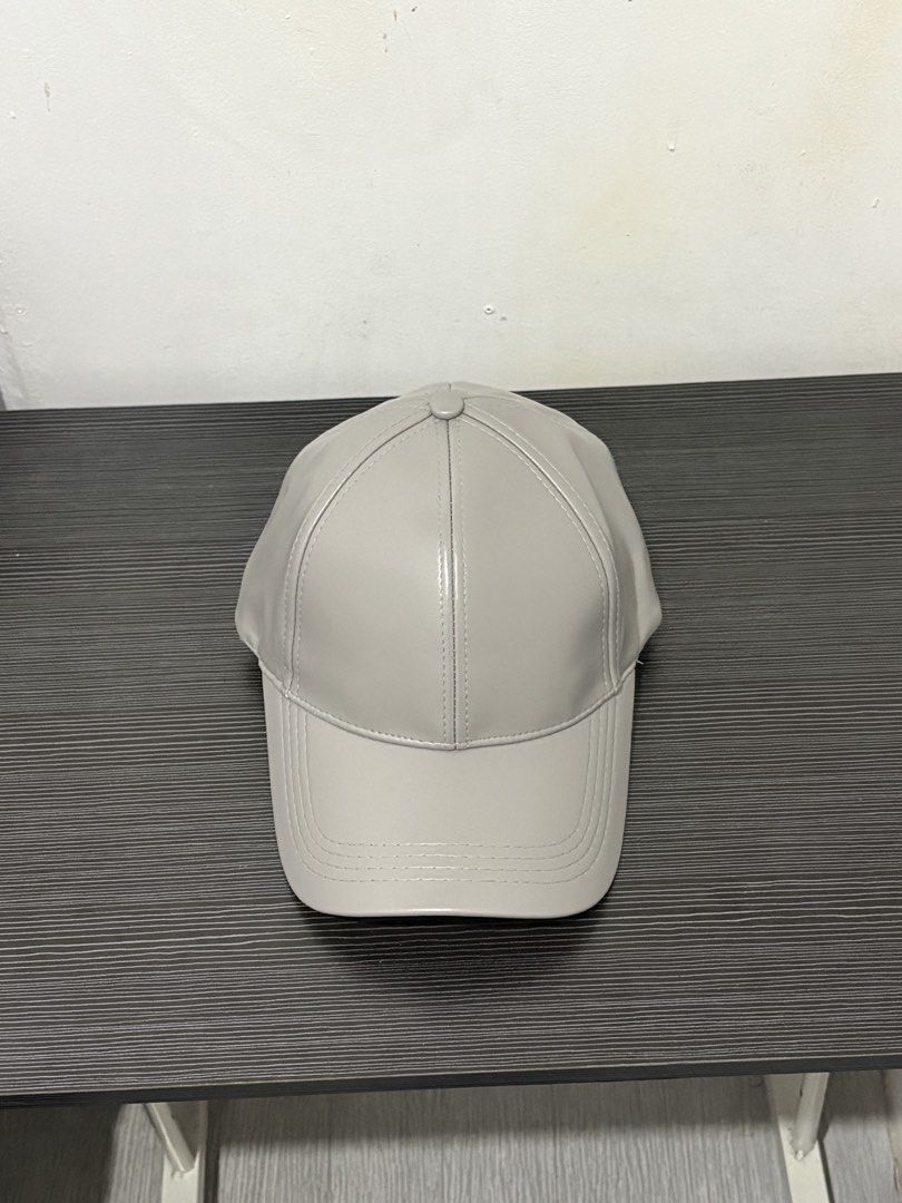 Grey Faux Leather Baseball Cap (Category: Caps & Hats) located in Quezon City. Submitted by batch. (Listing ID 1459627846, Image 3). Description: 6 panels and adjustable Never been used. Color and condition 10/10 Free shipping.
