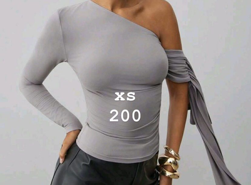 Grey One-Sleeve Ruched Top XS (Category: Blouses) located in Cebu City. Submitted by nicol3nicgks (Listing ID 1459626011, Image 2). Description: - Stylish grey one-sleeve top - Features elegant ruched detail on the sleeve - Made with comfortable, stretchy material - Best fits XS size - Versatile piece: dress it up or down! 200 each.