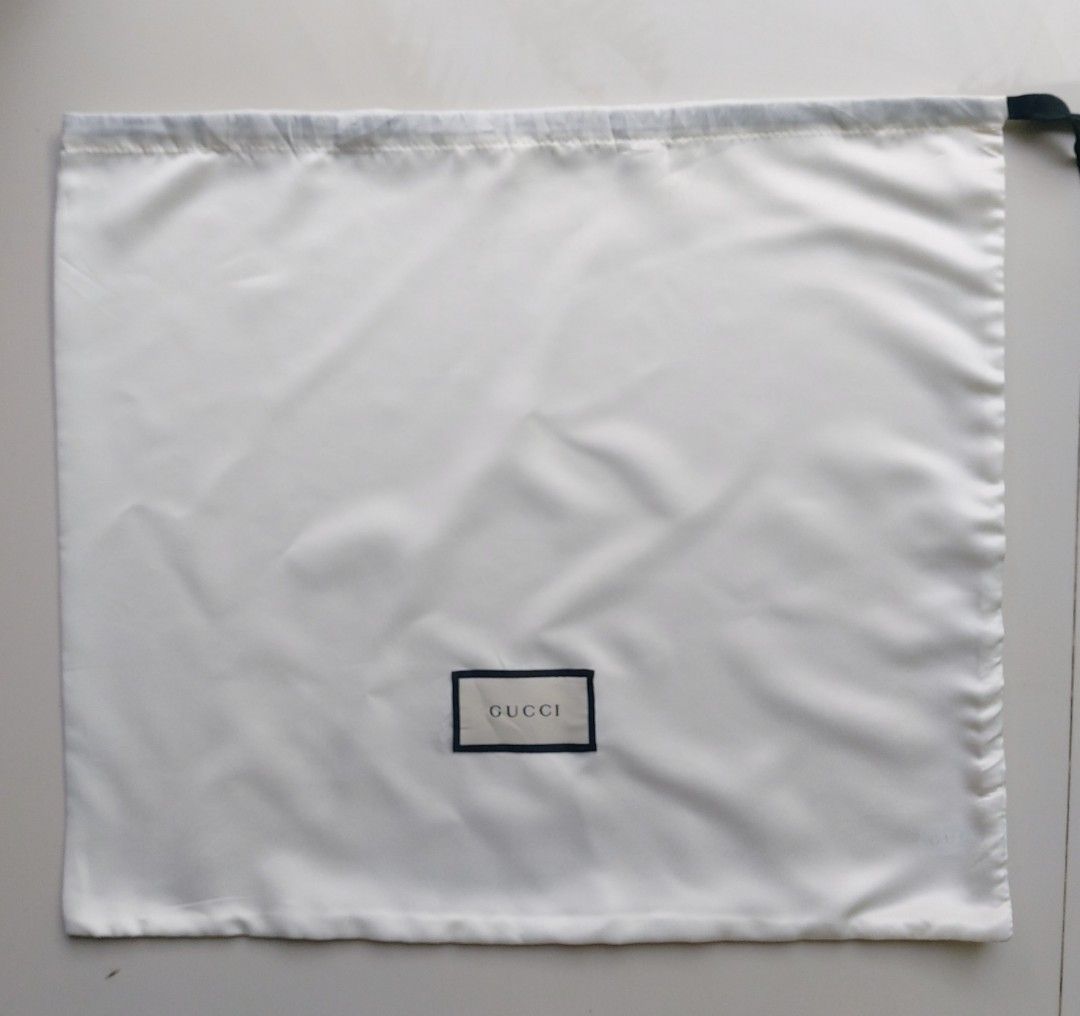 Gucci Dust Bag (Category: Luxury Bags & Wallets) located in Lapu Lapu. Submitted by agnesapm_29813 (Listing ID 1459593187, Image 1). Description: - Authentic Gucci dust bag - Iconic embroidered Gucci logo - Secure drawstring closure - Made in China (100% polyester) - Perfect for storing and protecting Gucci bags and accessories - Measurements: width-18 inches, height-15 inches .