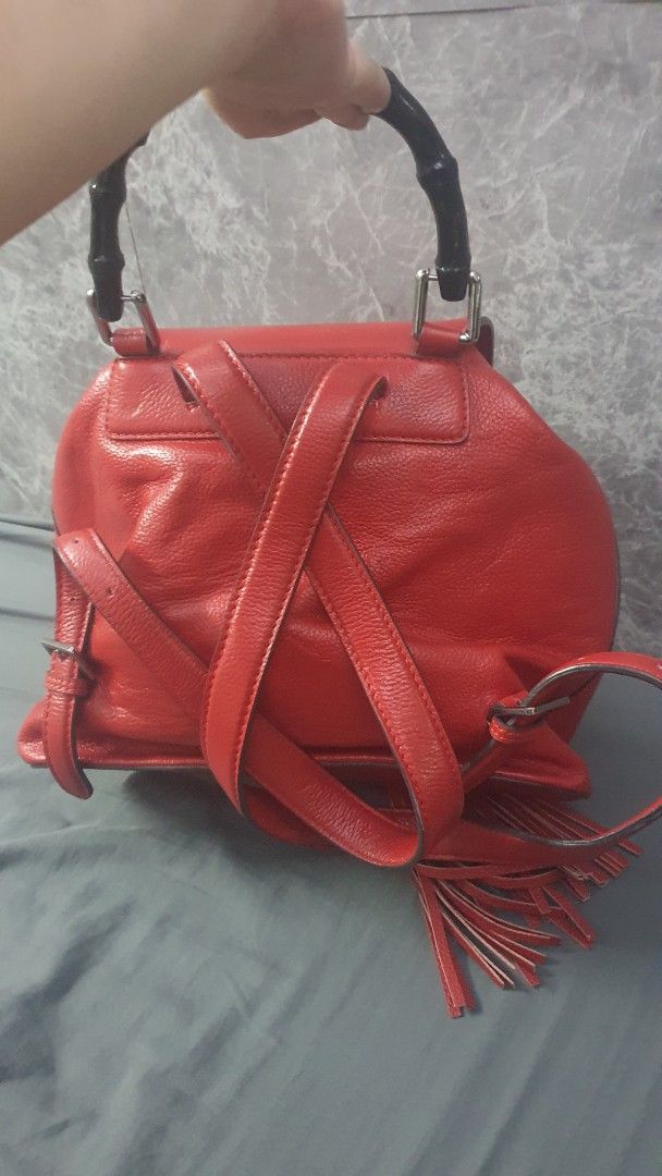 Gucci Flap Bamboo BackPack (Category: Backpacks) located in Manila. Submitted by togodbethegloryteamjesus (Listing ID 1459529862, Image 2). Description: - Red Leather Gucci Backpack - Signature Bamboo Accents on Front Pockets & Top Handle - Stylish Tassel Details - Secure Buckle Closure on Flap - Adjustable Straps for Comfort - Spacious Interior for Everyday Essentials - Perfect for Daily Use.