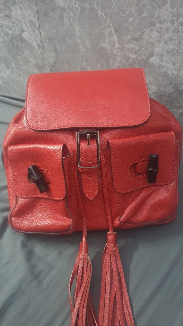 Gucci Flap Bamboo BackPack (Category: Backpacks) located in Manila. Submitted by togodbethegloryteamjesus (Listing ID 1459529862, Image 1). Description: - Red Leather Gucci Backpack - Signature Bamboo Accents on Front Pockets & Top Handle - Stylish Tassel Details - Secure Buckle Closure on Flap - Adjustable Straps for Comfort - Spacious Interior for Everyday Essentials - Perfect for Daily Use.