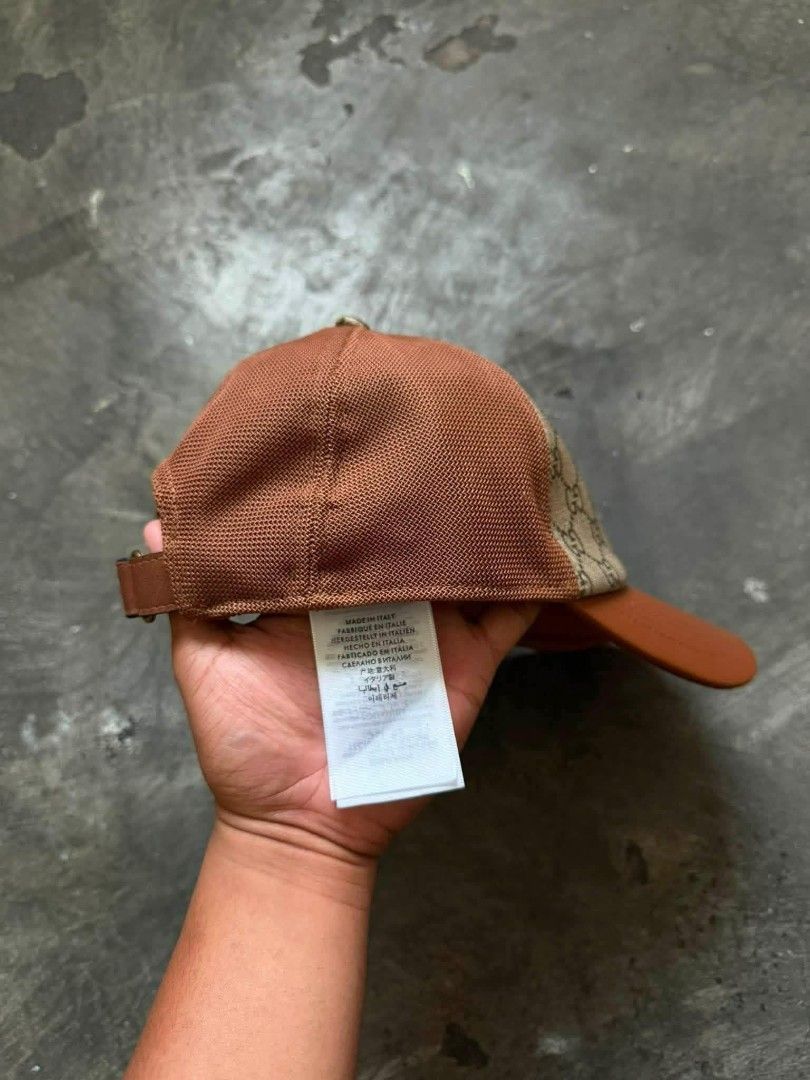 GUCCI GG MONOGRAM (Category: Caps & Hats) located in Pasig City. Submitted by dees_collection (Listing ID 1459625604, Image 2). Description: That is a brown and beige Gucci GG monogram baseball cap featuring a smooth leather visor and mesh detailing. MESSAGE FOR INTERESTED..
