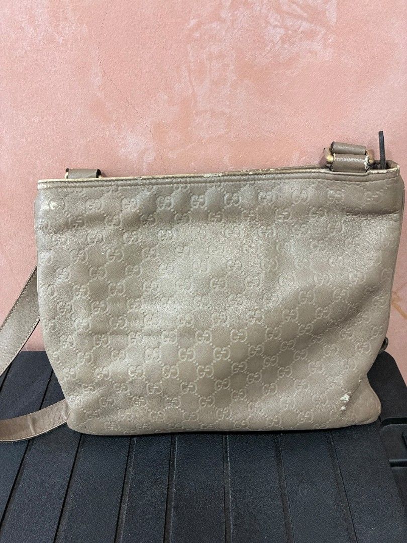 Gucci Guccissima messenger bag (Category: Luxury Bags & Wallets) located in Cebu City. Submitted by beagles30 (Listing ID 1459551926, Image 3). Description: gucci guccissima messenger bag leather embossed gucci logo guaranteed authentic first owner ako leather not nylon! selling rush price 10k pesos negotiable see pictures sa slight issues has scuffs on leather sa back part ng bag can be redyed. #gucci #lv #prada #bags.